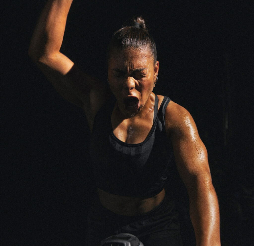 Les Mills Sprint instructor sweating with open mouth